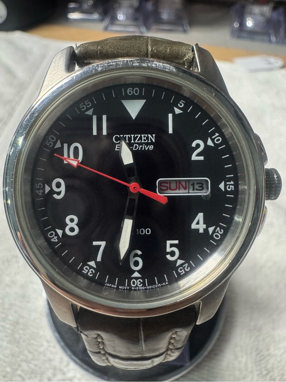 Citizen Men's Black Dial Watch with Red Second Hand and Brown Strap